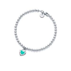 Tiffany & Co. SS bracelet with blue enamel heart